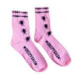 Pink crew socks with black cock roaches crawling up the socks with black Barbwire band on the top of it